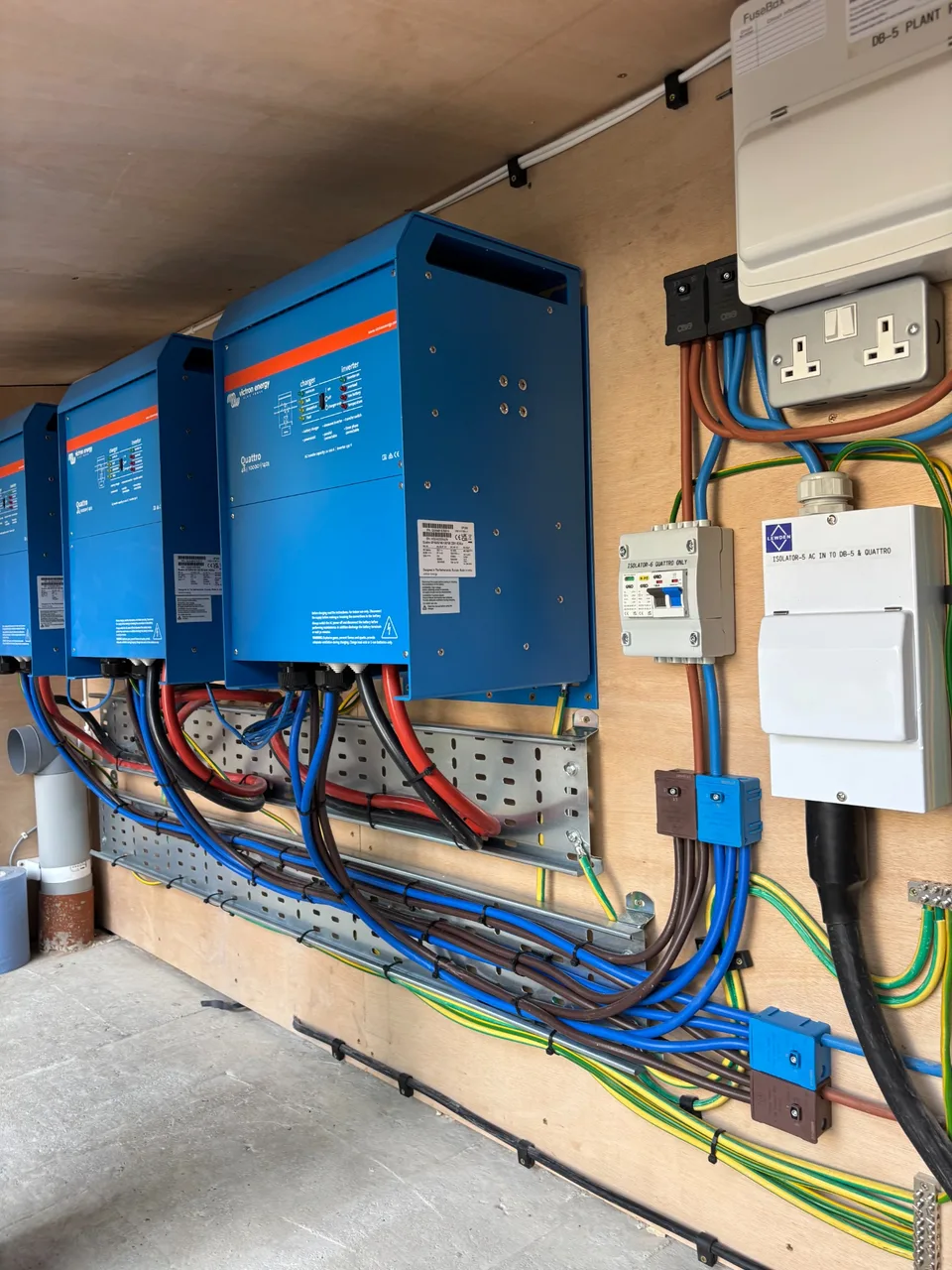 Three Victron Quattro inverter/chargers with associated electrical cabling and equipment